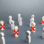 Airlines COLLAPSES — 1,800 Workers AXED Wooden figures with red X marks, signifying eliminated individuals