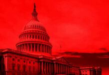 United States Capitol building under red-tinted sky