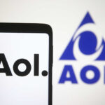 AOL DIES — Millions CUT OFF! Smartphone displaying the AOL logo with a blue AOL emblem in the background