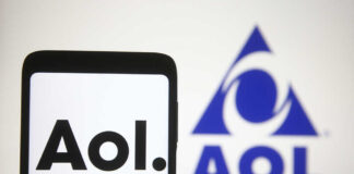Smartphone displaying the AOL logo with a blue AOL emblem in the background
