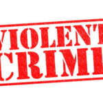 Shocking Violence Raises Alarming Gun Debate Red stamp with the words VIOLENT CRIME