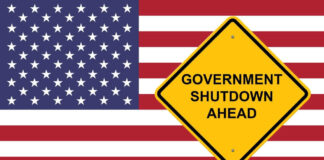 American flag government shutdown warning sign