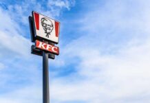 KFC restaurant sign against a blue sky