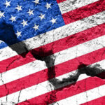 Cracked United States flag on textured surface