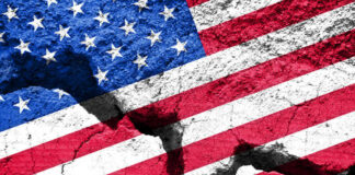 Cracked United States flag on textured surface