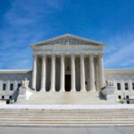 TODAY: Landmark Supreme Court Battles Begin U.S. Supreme Court building under clear blue sky
