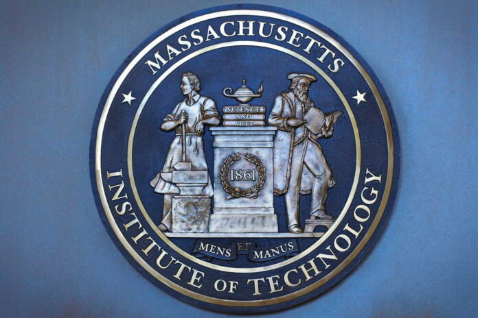 shutterstock_634520225.jpg Bronze seal of the Massachusetts Institute of Technology featuring two figures and the year 1861