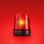 Red emergency light on red background