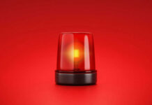 Red emergency light on red background