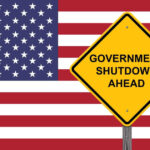 American flag government shutdown warning sign