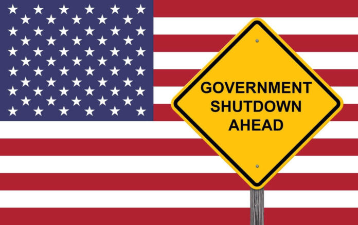 American flag government shutdown warning sign