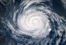 Aerial view of a swirling hurricane over the ocean