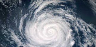 Aerial view of a swirling hurricane over the ocean