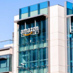 Exterior view of an Amazon corporate building with a glass facade