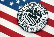 Fed Civil War ERUPTS — Dangerous Fractures Exposed Federal Reserve System emblem on an American flag background
