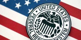 Federal Reserve System emblem on an American flag background