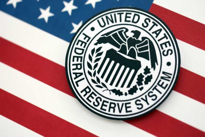 shutterstock_2699540189.jpg Federal Reserve System emblem on an American flag background