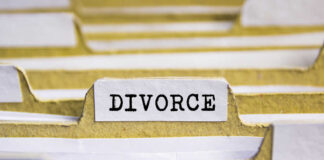 Close-up of a file labeled 'DIVORCE' among other documents