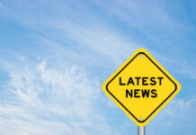 Midnight MASSACRE Rocks Village Yellow sign with text Latest News on sky background