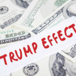 Text Trump Effect over hundred dollar bills