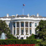 White House with trees and fountain.