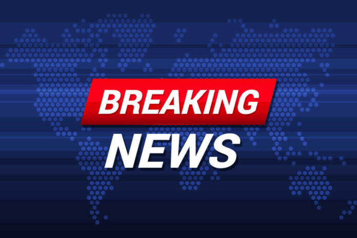 Breaking News text on world map background.