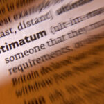 Trump’s New Ultimatum Sparks Showdown Close-up of a dictionary page showing the definition of 'ultimatum'