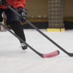 Women’s Hockey Team SNUBS Trump Invite Close-up of hockey players on ice with sticks in motion