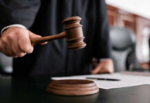 Trump Report BURIED Forever — Judge Slams Door Judge holding gavel in courtroom.