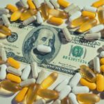 $49 Pill BANISHED — Federal Crackdown Shocks Market A one hundred dollar bill surrounded by various capsules and pills