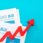 Electricity and gas bills with a red upward arrow