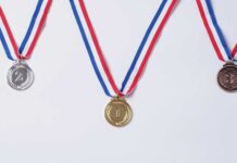 Olympic Medals SHATTERING During Victory Celebrations Three medals representing first, second, and third place