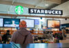 Starbucks counter in busy airport shopping area