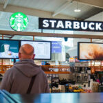 Starbucks counter in busy airport shopping area