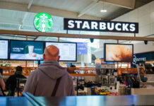 Starbucks counter in busy airport shopping area