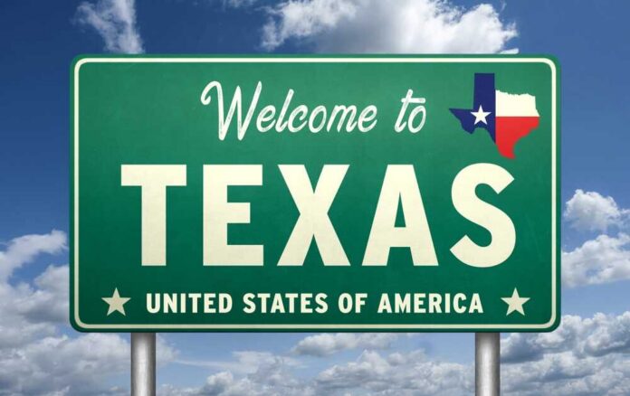 shutterstock_2661166119.jpg Welcome sign for Texas with the state flag
