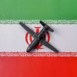 A model airplane placed on the Iranian flag