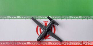 A model airplane placed on the Iranian flag