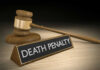 Gavel beside death penalty sign on desk