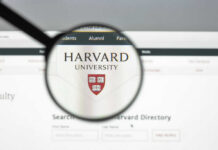 Epstein Documents Destroy Harvard Power Player Magnifying glass focusing on Harvard University logo online