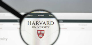 Magnifying glass focusing on Harvard University logo online