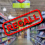 RECALL ALERT: Dangerous Mix-Up Discovered Blurred store aisle with RECALL stamp overlay.