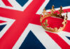 A golden crown resting on the Union Jack flag