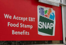 MAHA Agenda Aims at SNAP Recipients Red sign showing SNAP EBT food stamp benefits