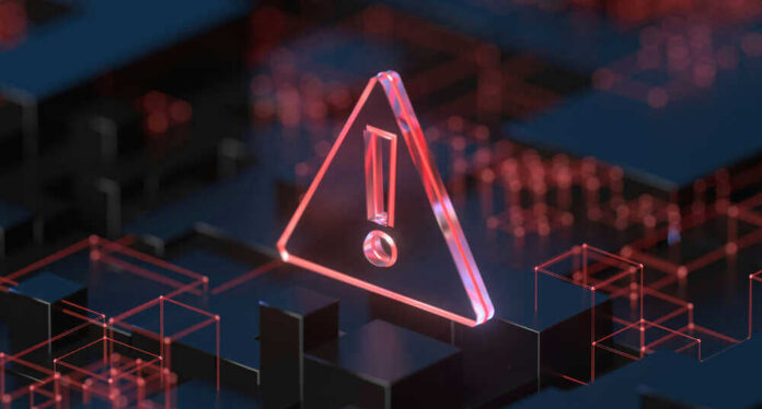 shutterstock_2023392170.jpg Red warning symbol on a dark digital background