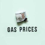 TODAY: War Sends Gas Above $4 A bundle of cash next to the words 'GAS PRICES' on a light green background