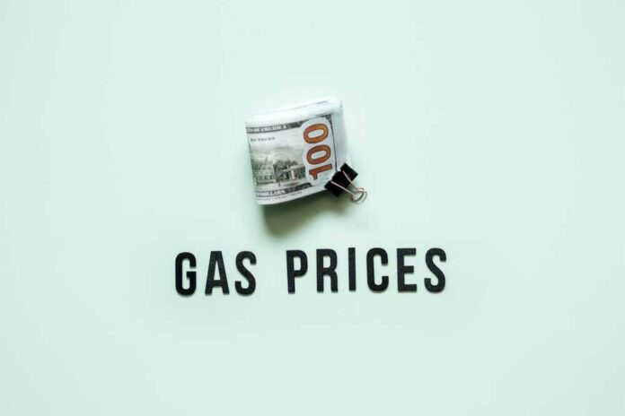 A bundle of cash next to the words 'GAS PRICES' on a light green background