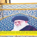CIA’s Bold Move Led To Khamenei’s Death Mural of Ali Khamenei with decorative background and text