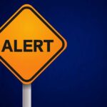 ALERT: 120-Year Dam Ready to BURST Orange alert sign with the word 'ALERT' displayed prominently