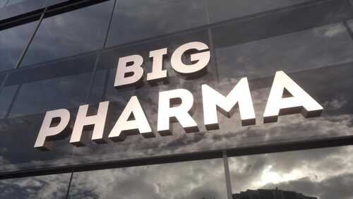 Sign displaying the words BIG PHARMA on a glass building